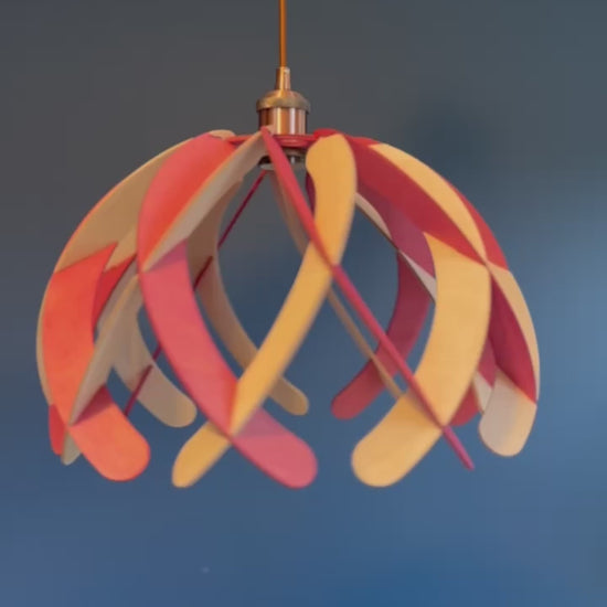 Short video showcasing different views of handcrafted wooden pendant lamps with a minimalistic "Ripple" design, highlighting the intricate craftsmanship, eco-friendly materials, and vibrant colors of water stain finish.