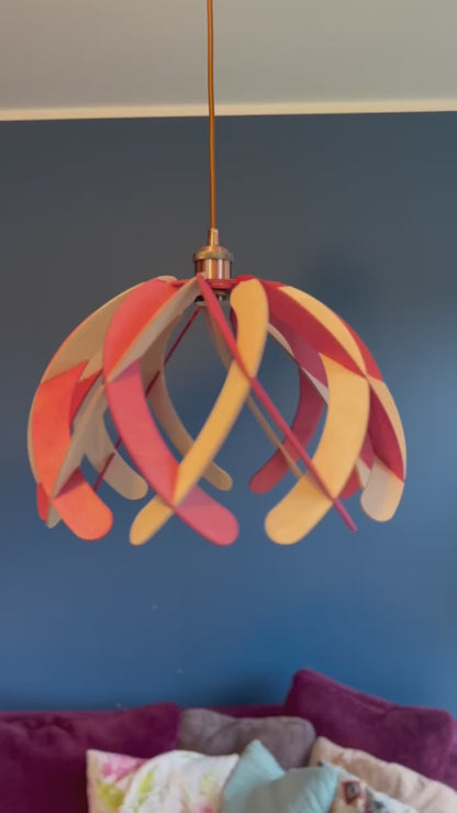 Short video showcasing different views of handcrafted wooden pendant lamps with a minimalistic "Ripple" design, highlighting the intricate craftsmanship, eco-friendly materials, and vibrant colors of water stain finish.