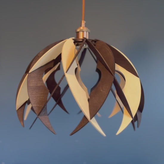 Short video showcasing different views of the handcrafted medium wooden pendant lamp with an art deco-inspired design. The video highlights the unique silhouette, eco-friendly materials, and the modern aesthetics.